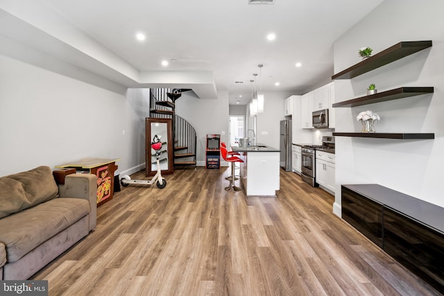 2221 M St NE Unit Ph1, Washington, DC 20002 - living area with stairs, light wood-type flooring, recessed lighting, and baseboards