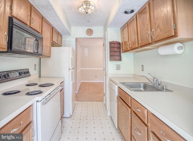 106 Gwen Dr Unit 106-1J, Forest Hill, MD 21050 - kitchen featuring white appliances, a sink, light floors, light countertops, and a textured ceiling