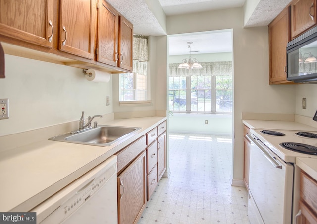 106 Gwen Dr Unit 106-1J, Forest Hill, MD 21050 - kitchen with white appliances, a sink, light flooring, and light countertops