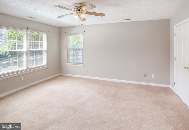 106 Gwen Dr Unit 106-1J, Forest Hill, MD 21050 - empty room with a textured ceiling, ceiling fan, light colored carpet, and baseboards