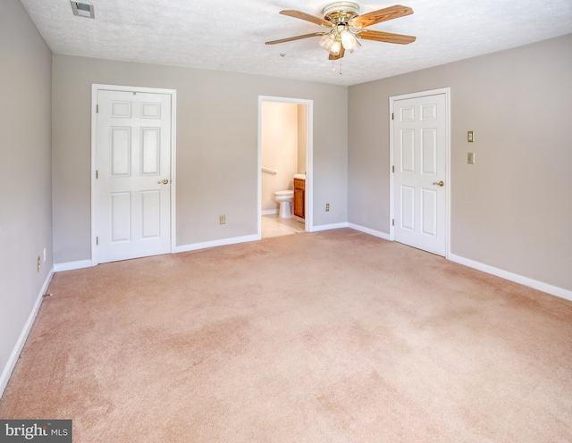 106 Gwen Dr Unit 106-1J, Forest Hill, MD 21050 - unfurnished bedroom with light colored carpet, baseboards, ensuite bath, a textured ceiling, and a ceiling fan