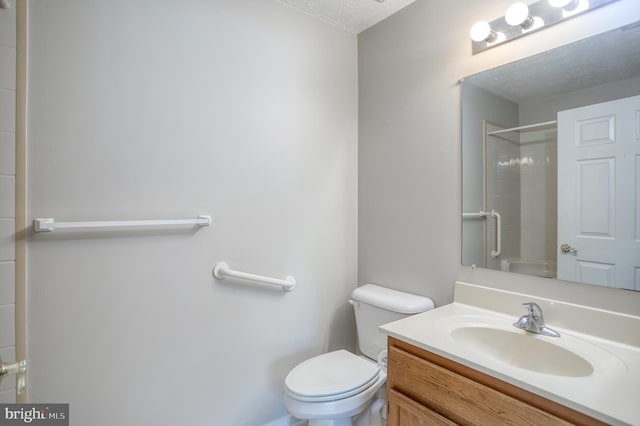 106 Gwen Dr Unit 106-1J, Forest Hill, MD 21050 - bathroom with toilet, vanity, a textured ceiling, and a shower