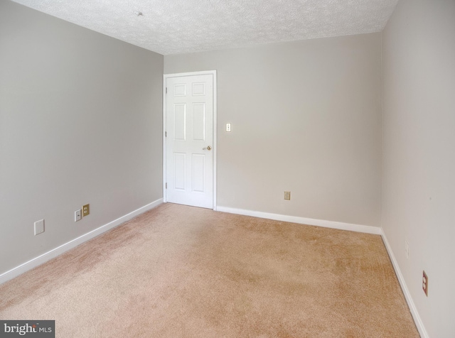 106 Gwen Dr Unit 106-1J, Forest Hill, MD 21050 - empty room featuring a textured ceiling, carpet, and baseboards