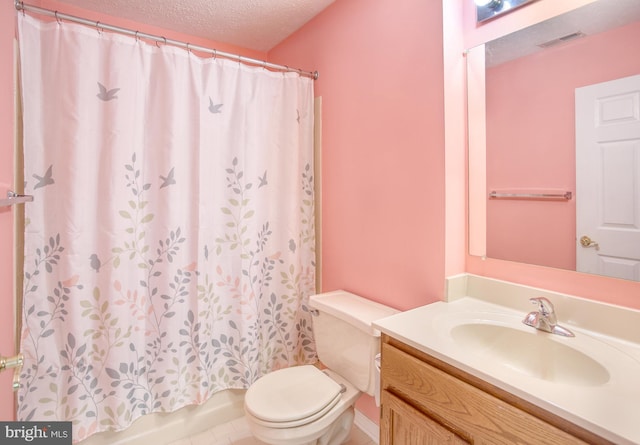 106 Gwen Dr Unit 106-1J, Forest Hill, MD 21050 - bathroom featuring vanity, toilet, a textured ceiling, and shower / tub combo