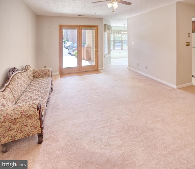 106 Gwen Dr Unit 106-1J, Forest Hill, MD 21050 - living room featuring a ceiling fan, light carpet, and baseboards