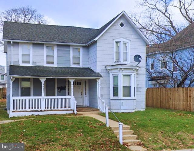 619 Sewall Ave, Asbury Park, NJ 07712 - view of front of house with a porch and roof with shingles