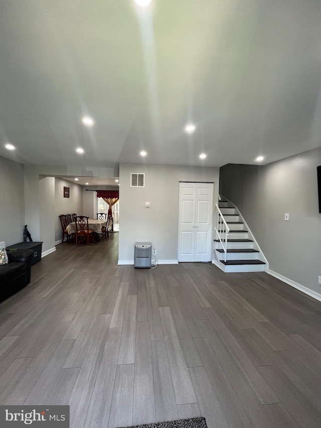 120 N Baylor Dr, Sterling, VA 20164 - basement with wood finished floors, stairway, baseboards, and recessed lighting