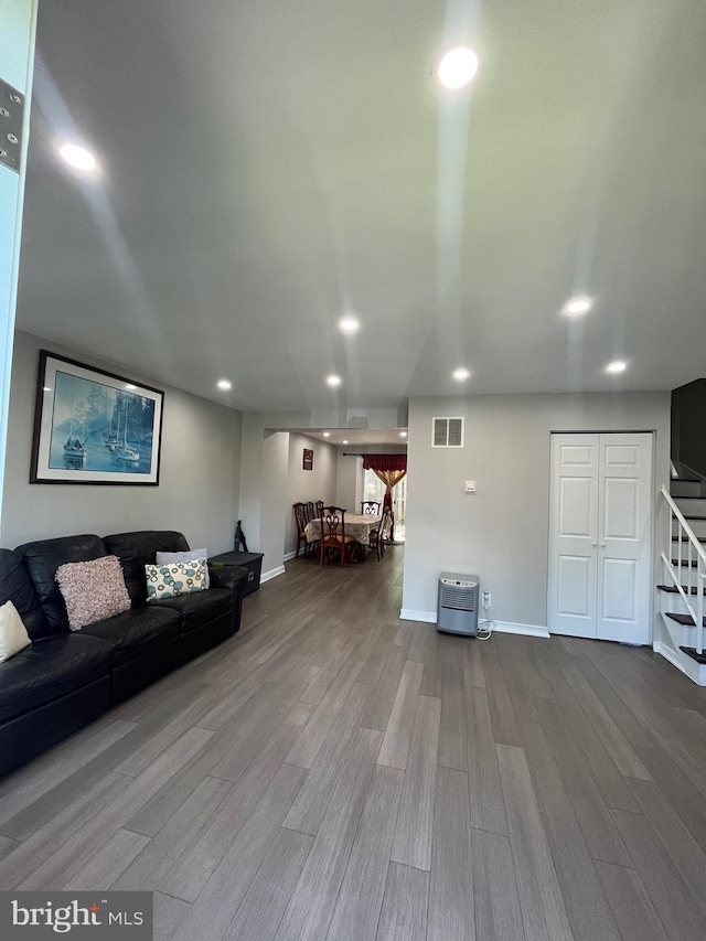 120 N Baylor Dr, Sterling, VA 20164 - living area featuring stairway, wood finished floors, baseboards, and recessed lighting