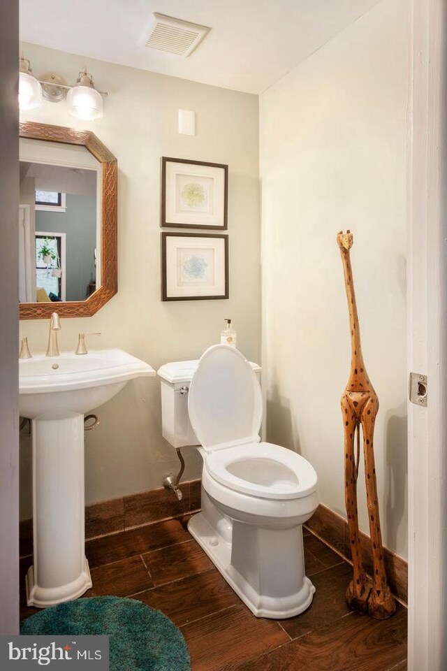 2905 Monterey Ct, Springfield, PA 19064 - bathroom with toilet and wood finished floors