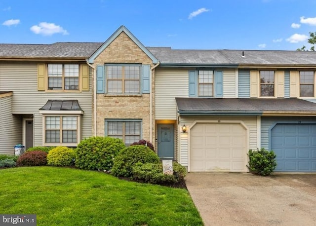 74 Haverford Ct, Hillsborough, NJ 08844 - townhome / multi-family property featuring driveway, an attached garage, a front lawn, and brick siding