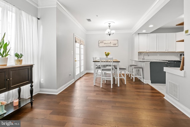 2738 Fresh Water Way, Odenton, MD 21113 - dining space with crown molding, a chandelier, dark wood-style flooring, baseboards, and recessed lighting