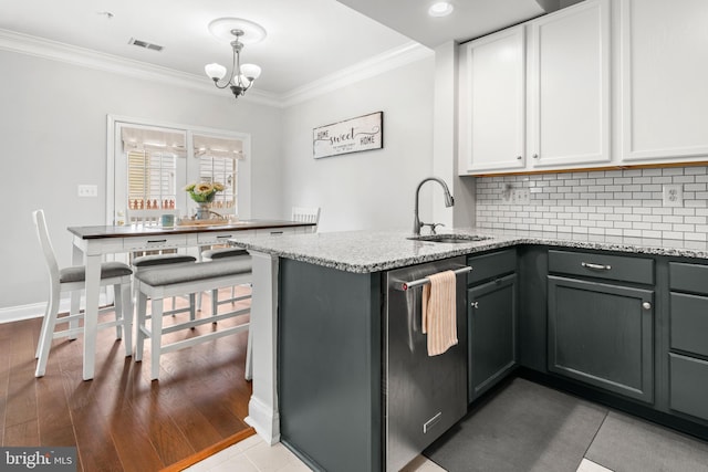 2738 Fresh Water Way, Odenton, MD 21113 - kitchen with stainless steel dishwasher, a sink, crown molding, a chandelier, and decorative backsplash