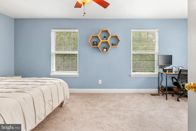 2738 Fresh Water Way, Odenton, MD 21113 - carpeted bedroom featuring multiple windows, baseboards, a desk, and a ceiling fan