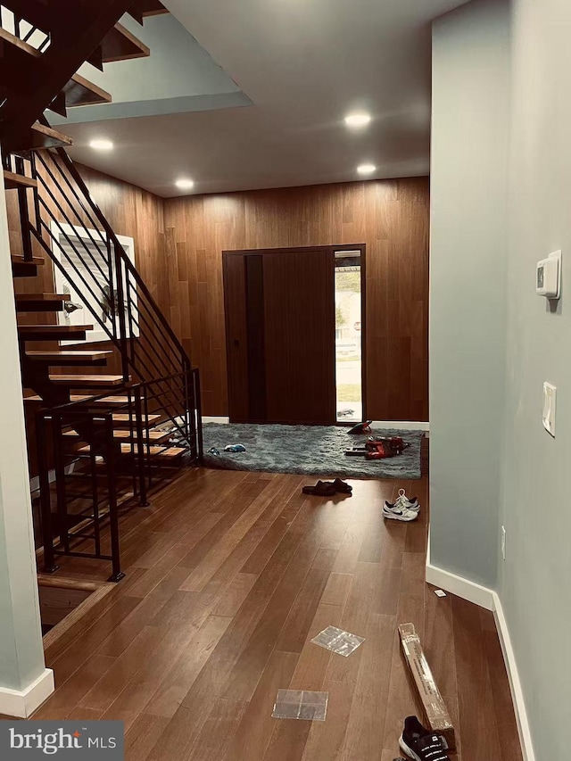 123 Bryn Mawr Ave, Bala Cynwyd, PA 19004 - entryway featuring hardwood / wood-style floors, stairs, baseboards, wood walls, and recessed lighting