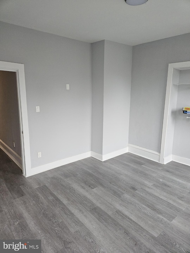 2549 N 29th St, Philadelphia, PA 19132 - empty room with dark wood-type flooring and baseboards
