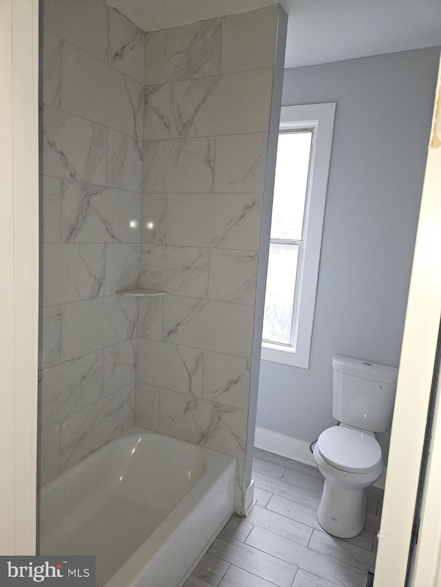 2549 N 29th St, Philadelphia, PA 19132 - bathroom with toilet, baseboards, and tub / shower combination