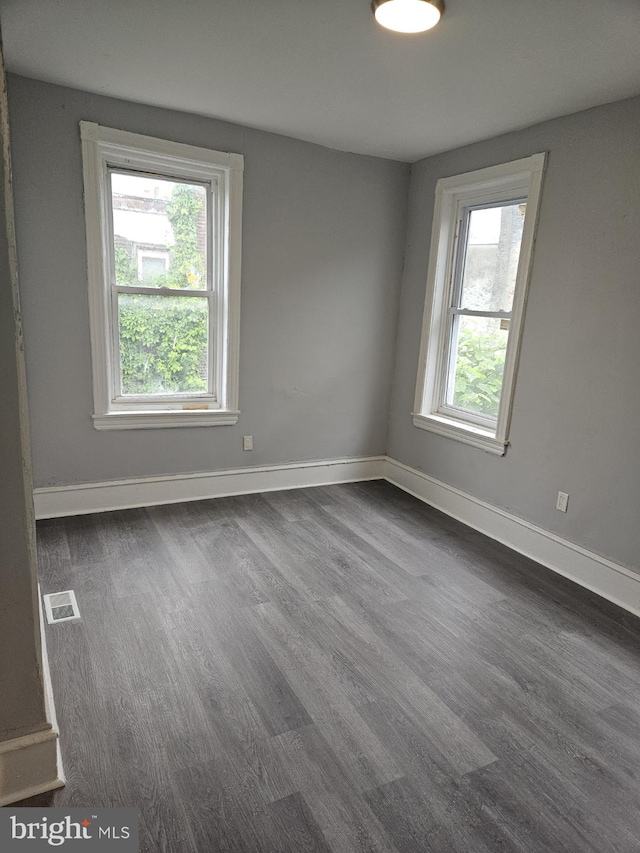 2549 N 29th St, Philadelphia, PA 19132 - unfurnished room featuring dark wood-type flooring and baseboards