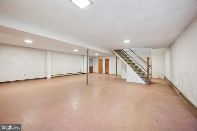 2055 Wharton Ave, Marcus Hook, PA 19061 - finished below grade area with recessed lighting, stairs, a baseboard heating unit, tile patterned floors, and a textured ceiling