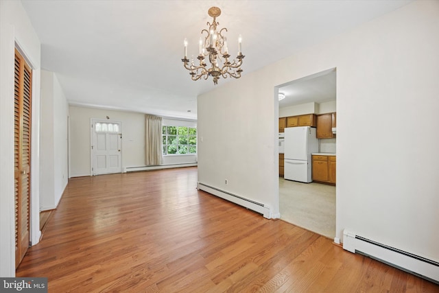 2055 Wharton Ave, Marcus Hook, PA 19061 - unfurnished living room with baseboard heating, light wood-style floors, and a chandelier