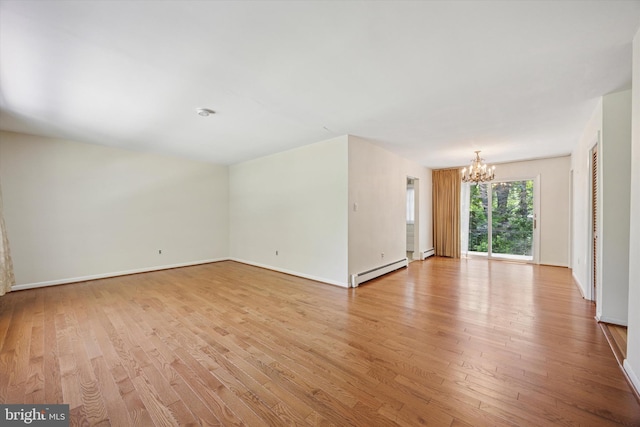 2055 Wharton Ave, Marcus Hook, PA 19061 - empty room with a chandelier, a baseboard radiator, light wood-type flooring, and baseboards