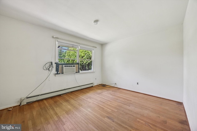 2055 Wharton Ave, Marcus Hook, PA 19061 - unfurnished room with baseboard heating, cooling unit, hardwood / wood-style floors, a smoke detector, and baseboards