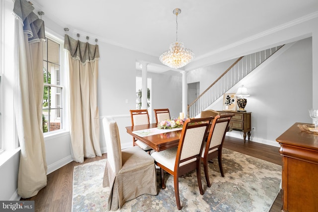 13443 Victory Gallop Way, Gainesville, VA 20155 - dining space with ornate columns, crown molding, wood finished floors, a chandelier, and stairway