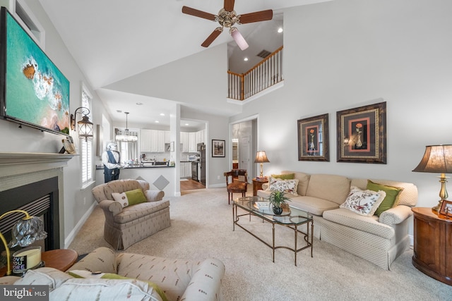 13443 Victory Gallop Way, Gainesville, VA 20155 - living room featuring light carpet, a ceiling fan, baseboards, recessed lighting, and a glass covered fireplace