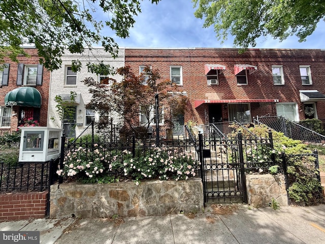 3344 Clay Pl NE, Washington, DC 20019 - view of front of property featuring brick siding, a fenced front yard, and a gate