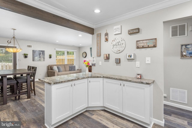 2 Gloucester Ct, Bordentown, NJ 08505 - kitchen with recessed lighting, light stone countertops, dark wood-type flooring, ornamental molding, and white cabinets