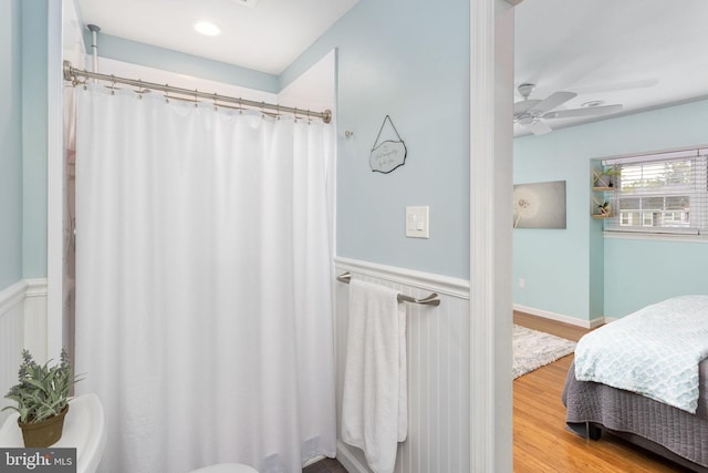 2 Gloucester Ct, Bordentown, NJ 08505 - ensuite bathroom featuring wood finished floors, a wainscoted wall, ceiling fan, and a shower with curtain