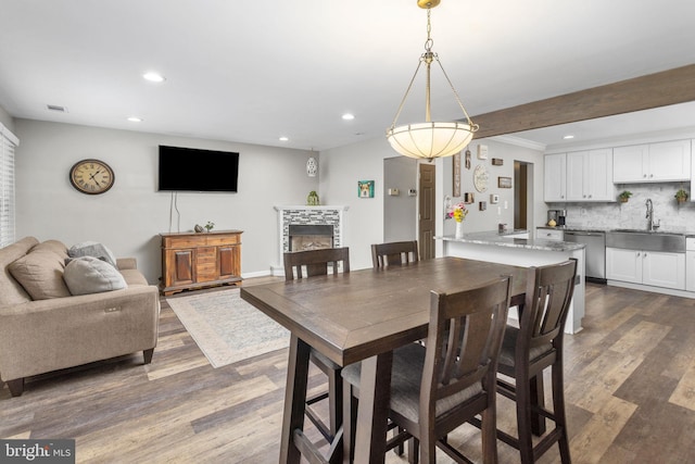 2 Gloucester Ct, Bordentown, NJ 08505 - dining area featuring recessed lighting, dark wood-style flooring, and a tile fireplace