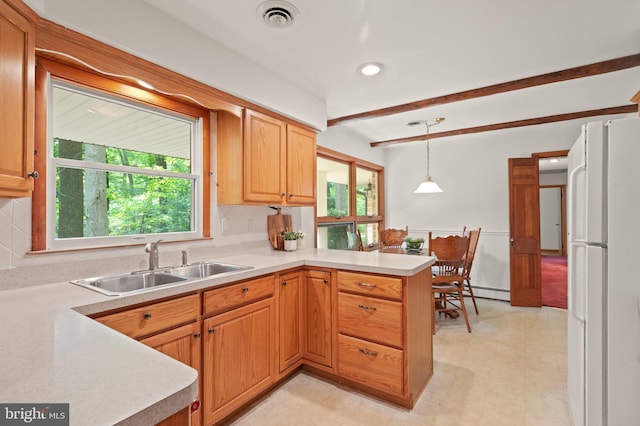 1906 Parkvue Rd, Fallston, MD 21047 - kitchen featuring freestanding refrigerator, a peninsula, tasteful backsplash, beamed ceiling, and light countertops