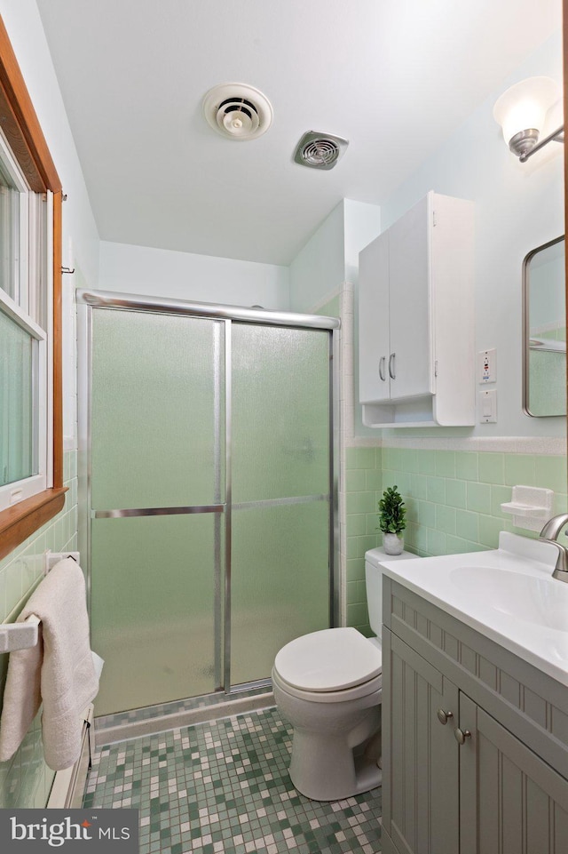 1906 Parkvue Rd, Fallston, MD 21047 - bathroom with tile walls, vanity, a stall shower, and wainscoting