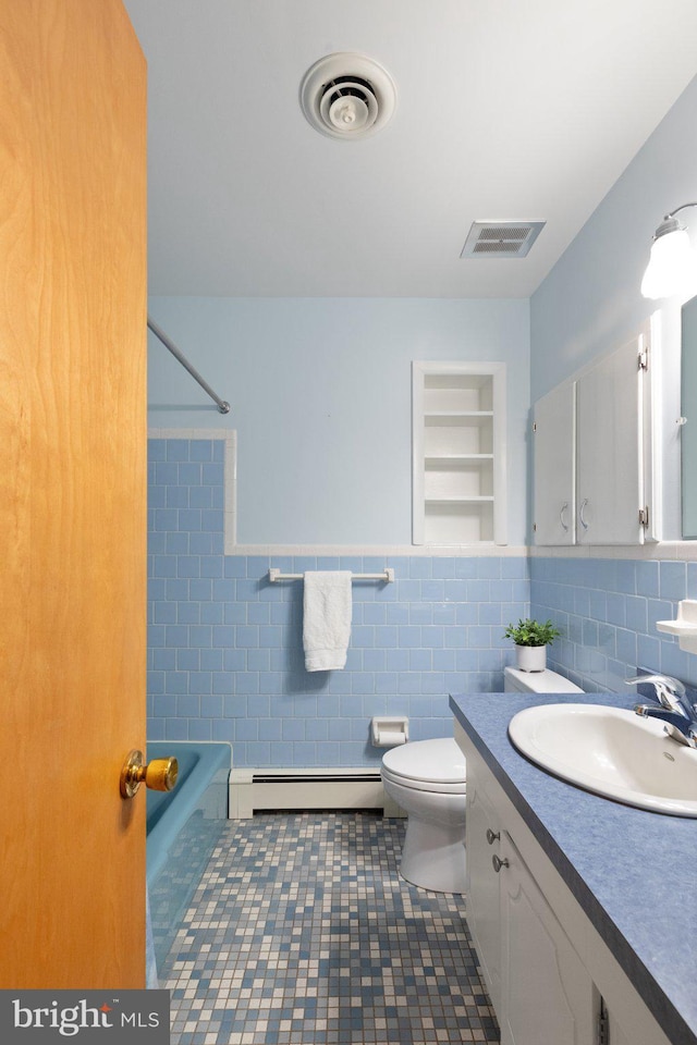 1906 Parkvue Rd, Fallston, MD 21047 - bathroom with baseboard heating, tile walls, vanity, tile patterned floors, and shower / tub combination