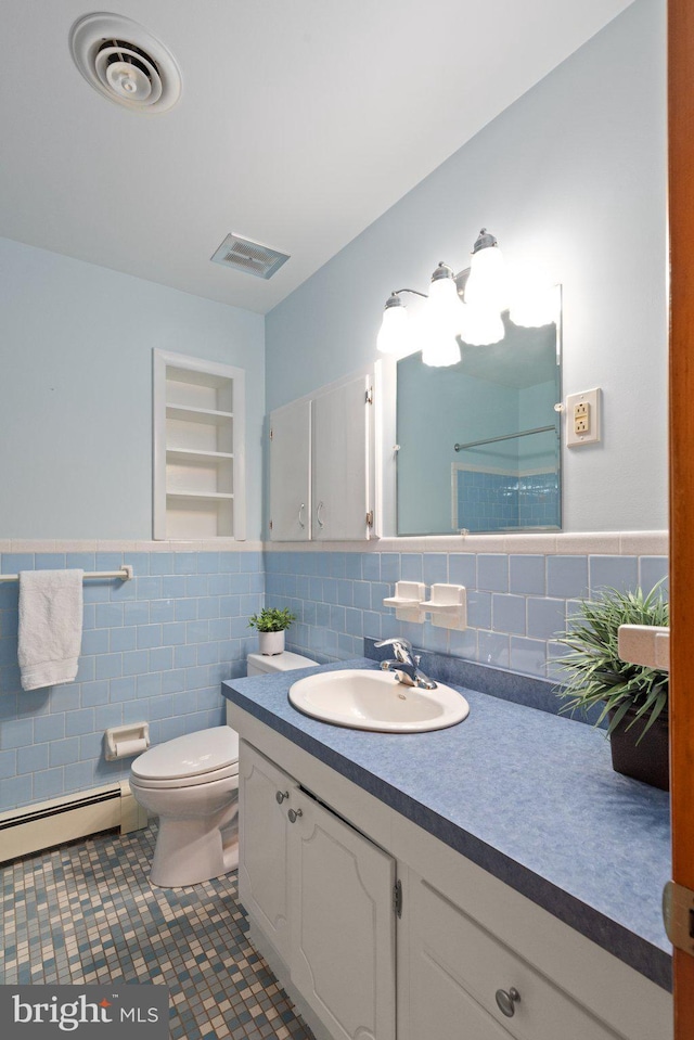 1906 Parkvue Rd, Fallston, MD 21047 - full bath featuring baseboard heating, vanity, tile walls, a wainscoted wall, and tile patterned flooring