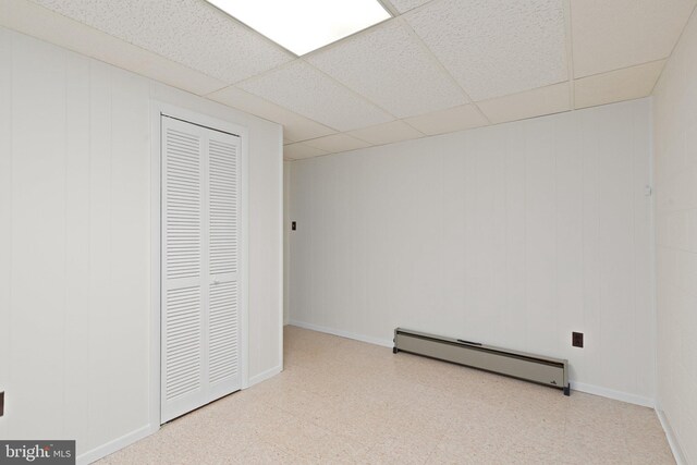 1906 Parkvue Rd, Fallston, MD 21047 - unfurnished bedroom with a baseboard heating unit, tile patterned floors, a drop ceiling, and a closet