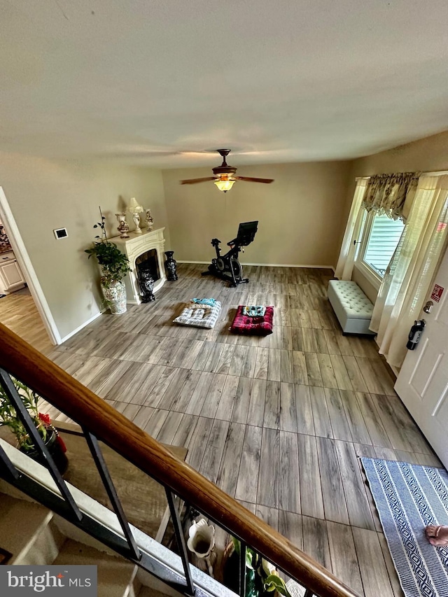 12403 Rambling Ln, Bowie, MD 20715 - living area featuring wood finished floors, ceiling fan, and a fireplace