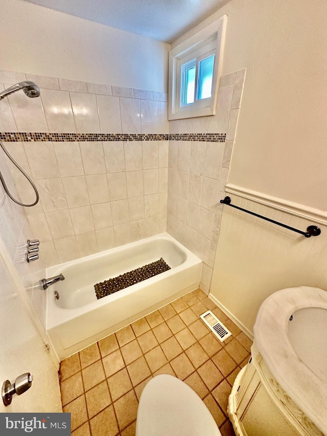 12403 Rambling Ln, Bowie, MD 20715 - bathroom with tile patterned floors,  shower combination, toilet, and a wainscoted wall