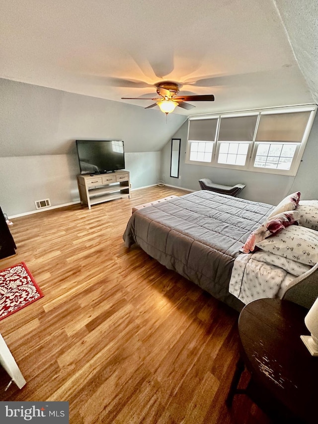 12403 Rambling Ln, Bowie, MD 20715 - bedroom featuring lofted ceiling, wood finished floors, baseboards, and ceiling fan
