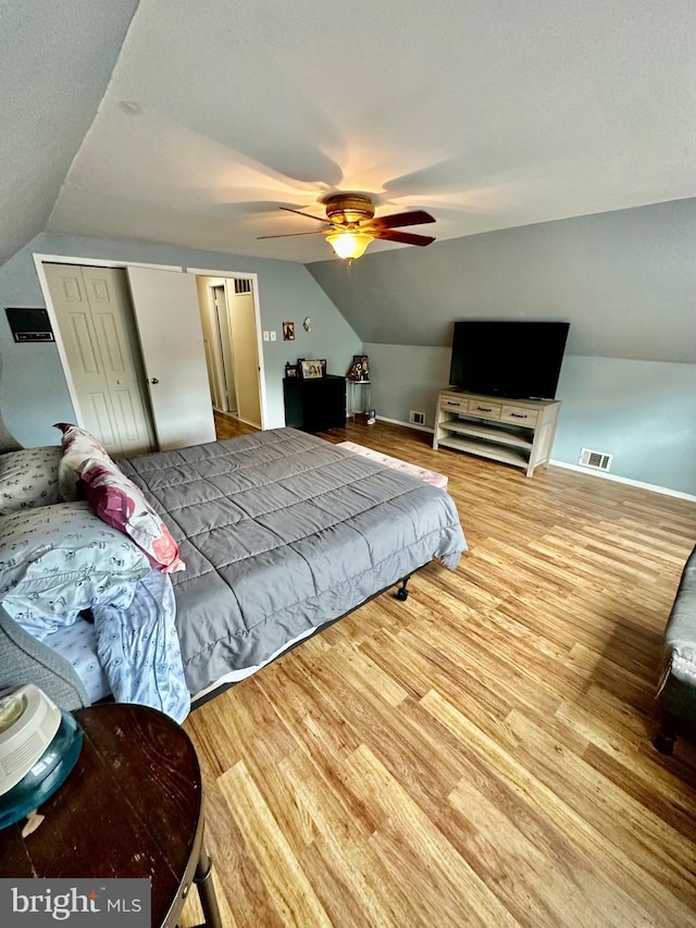 12403 Rambling Ln, Bowie, MD 20715 - bedroom featuring lofted ceiling, wood finished floors, a closet, and ceiling fan