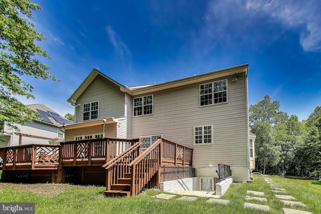 7009 Shagbark Ct, Fort Washington, MD 20744 - rear view of property with a wooden deck and a lawn