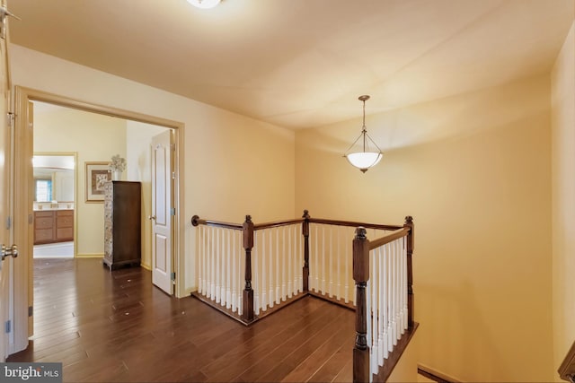 23412 Berkeley Meadows Dr, Ashburn, VA 20148 - hall featuring an upstairs landing, dark wood finished floors, and baseboards