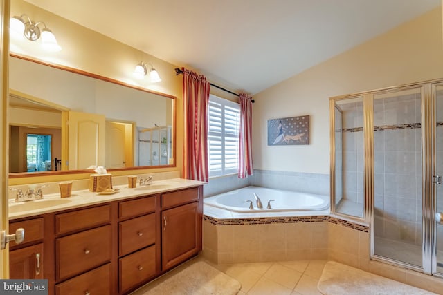 23412 Berkeley Meadows Dr, Ashburn, VA 20148 - full bathroom with vaulted ceiling, a shower stall, tile patterned floors, a bath, and double vanity
