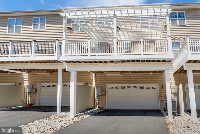 23412 Berkeley Meadows Dr, Ashburn, VA 20148 - rear view of house with a carport, driveway, and a garage