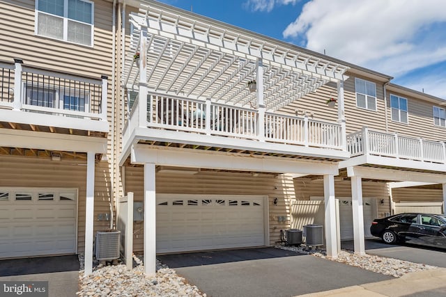 23412 Berkeley Meadows Dr, Ashburn, VA 20148 - view of front of property with a garage, driveway, and cooling unit