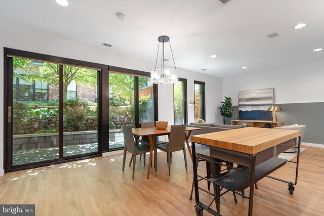 57 N St NW Unit 134, Washington, DC 20001 - dining space featuring light wood finished floors, recessed lighting, a chandelier, and baseboards
