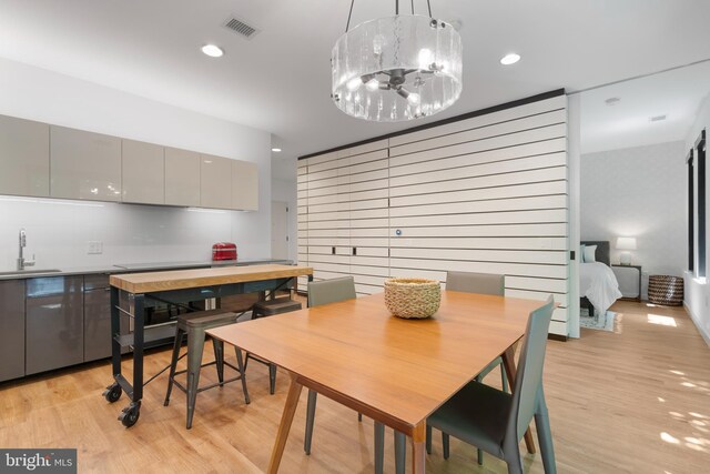 57 N St NW Unit 134, Washington, DC 20001 - dining area with light wood finished floors, a chandelier, and recessed lighting