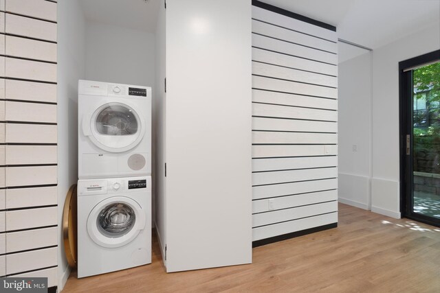 57 N St NW Unit 134, Washington, DC 20001 - laundry area featuring stacked washing machine and dryer and light wood-style floors