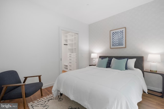 57 N St NW Unit 134, Washington, DC 20001 - bedroom featuring wood finished floors and baseboards