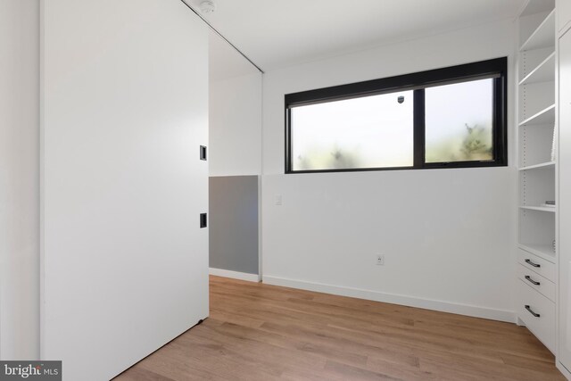 57 N St NW Unit 134, Washington, DC 20001 - empty room with light wood-style flooring and baseboards